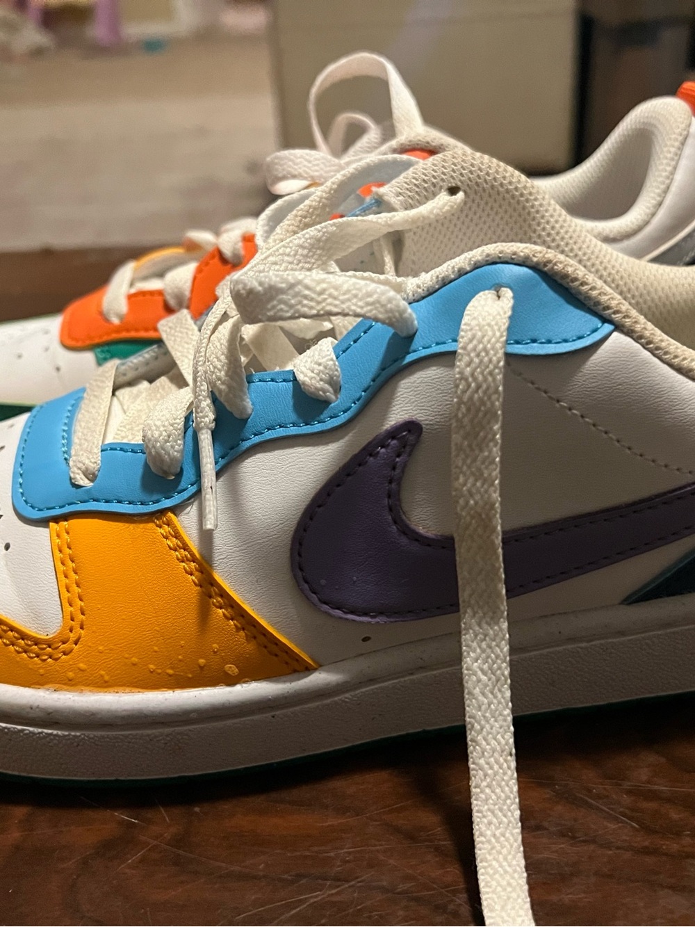 Nike Kids White Sneakers with Blue, Yellow & Purple Accents